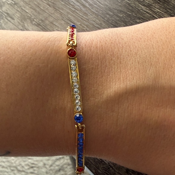 Jewelry - Elegant Gold Bracelet with Red, Blue, and White Accents